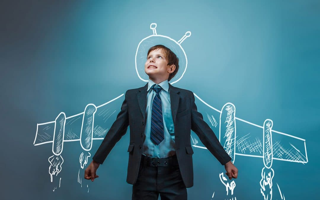 A boy looking up with imagination and confidence