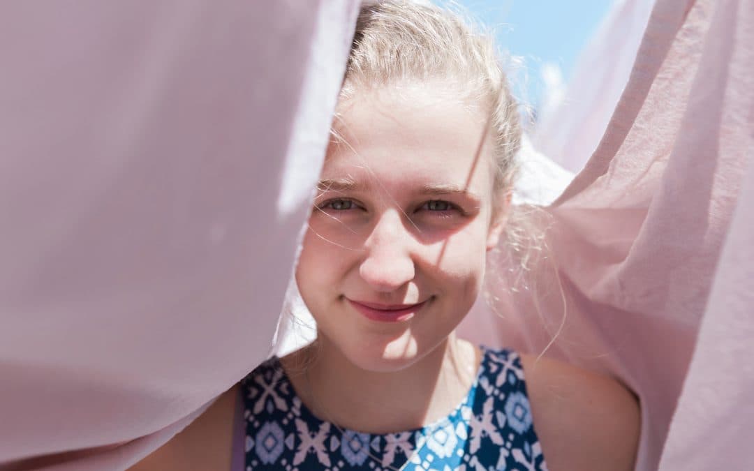 A young girl smiling